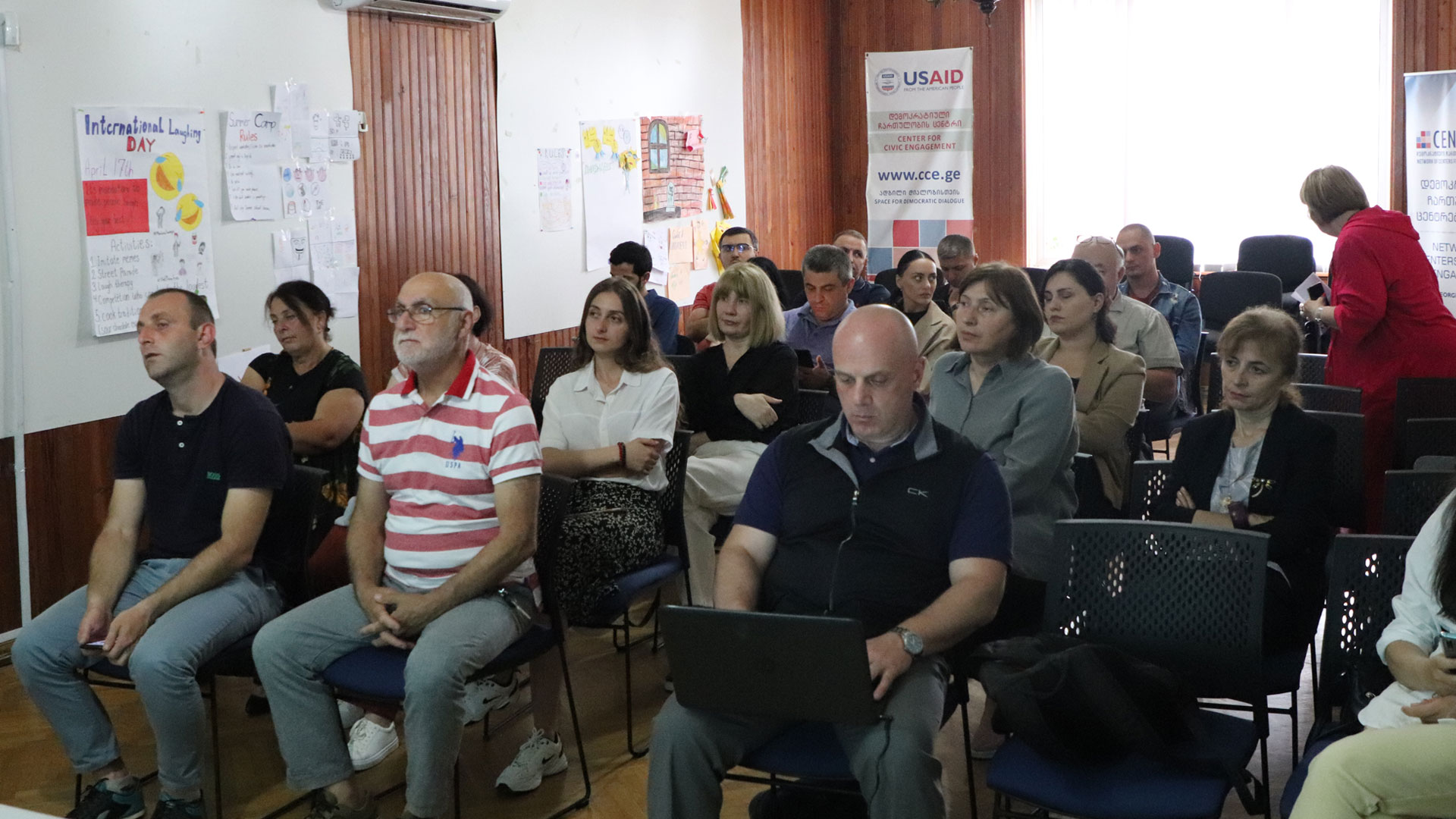 Participants sitting in a meeting room in a training session