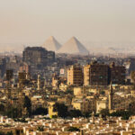 Panoramic view of city with pyramids in the background