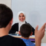 Student and teacher engage in class discussions