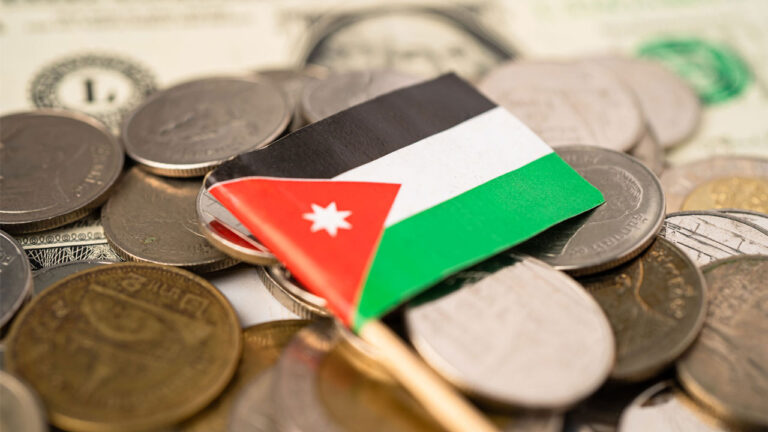 Flag of Jordan placed on top of the with currency