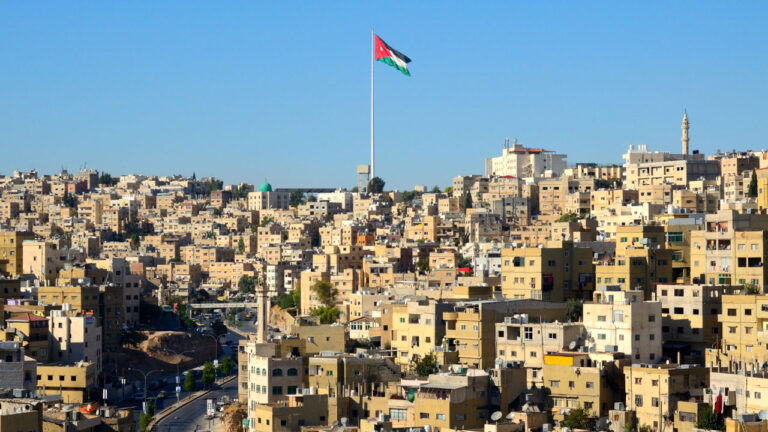 Flag of Jordan with a city view