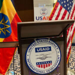 Podium with USAID emblem with the Ethiopian and USA flags in the background