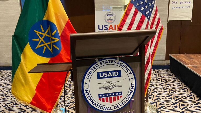 Podium with USAID emblem with the Ethiopian and USA flags in the background