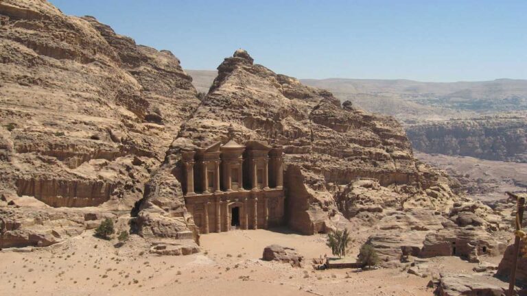 Building carved out of and built into rock face